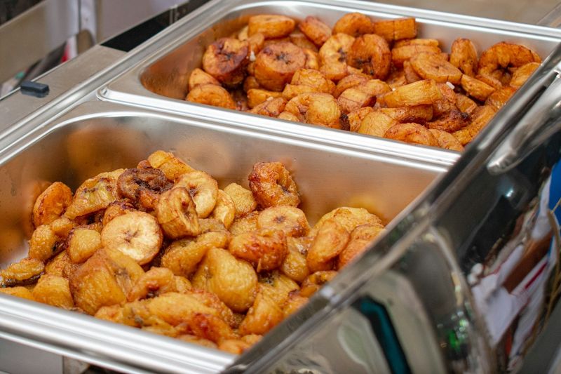 Trays of fried ripe plantain slices